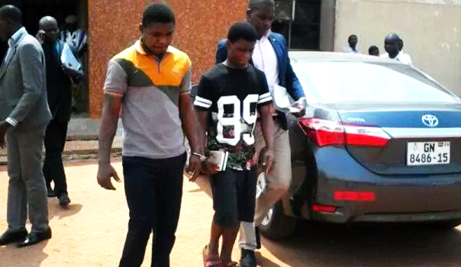 Daniel Asiedu (middle) and Vincent Bosso (left) being led out of the court premises